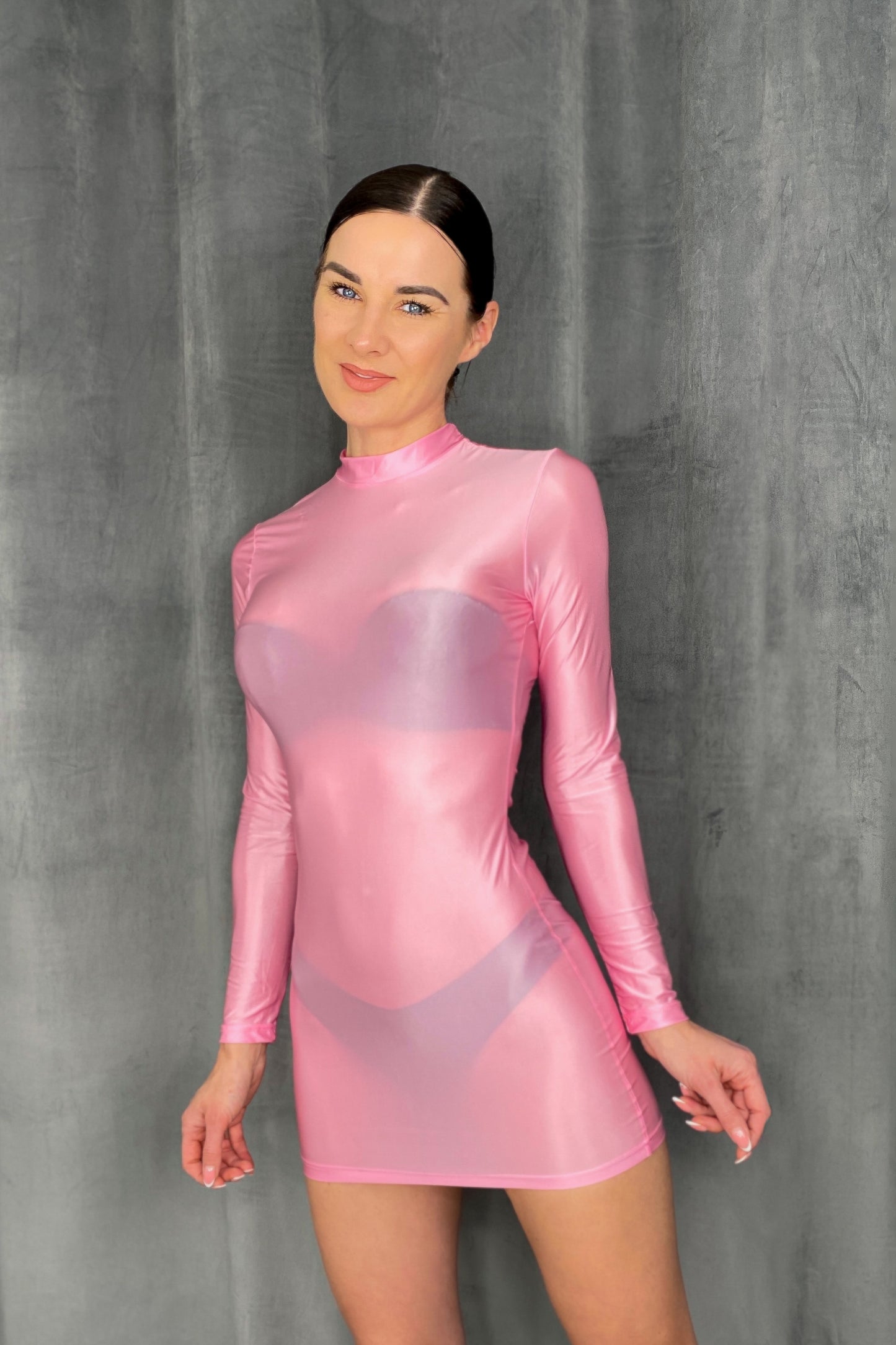 Pink spandex mini dress with high neck and long sleeves