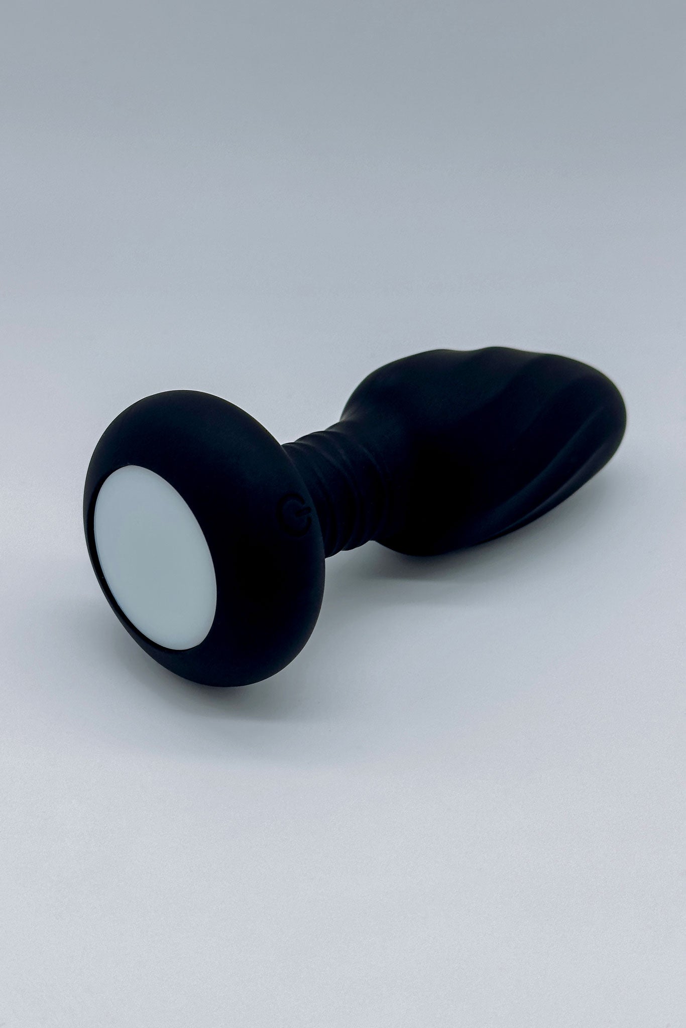 Light-up anal toy featuring 360-degree spinning motion