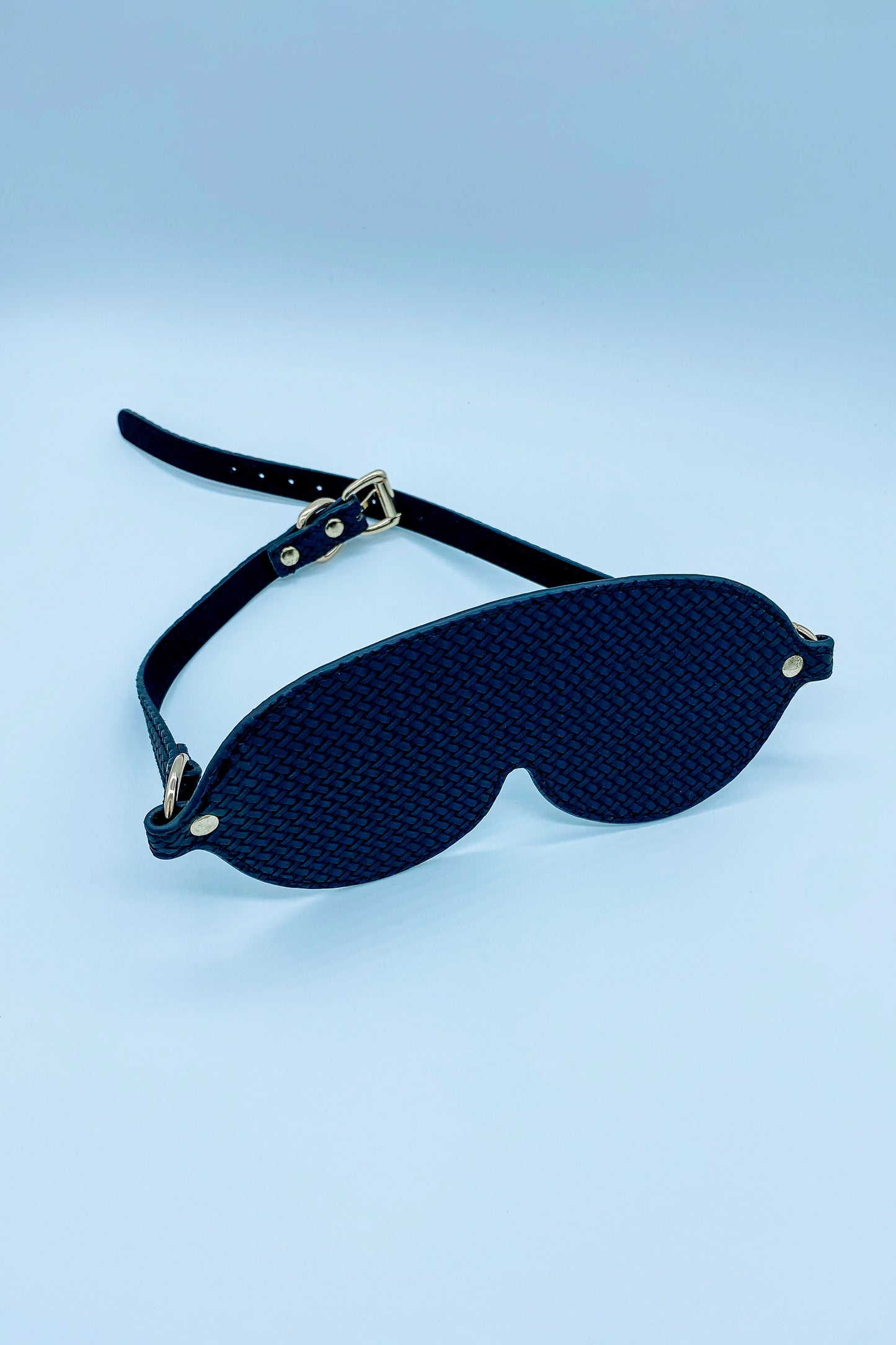 Elegant black faux leather blindfold – discreet and comfortable for roleplay