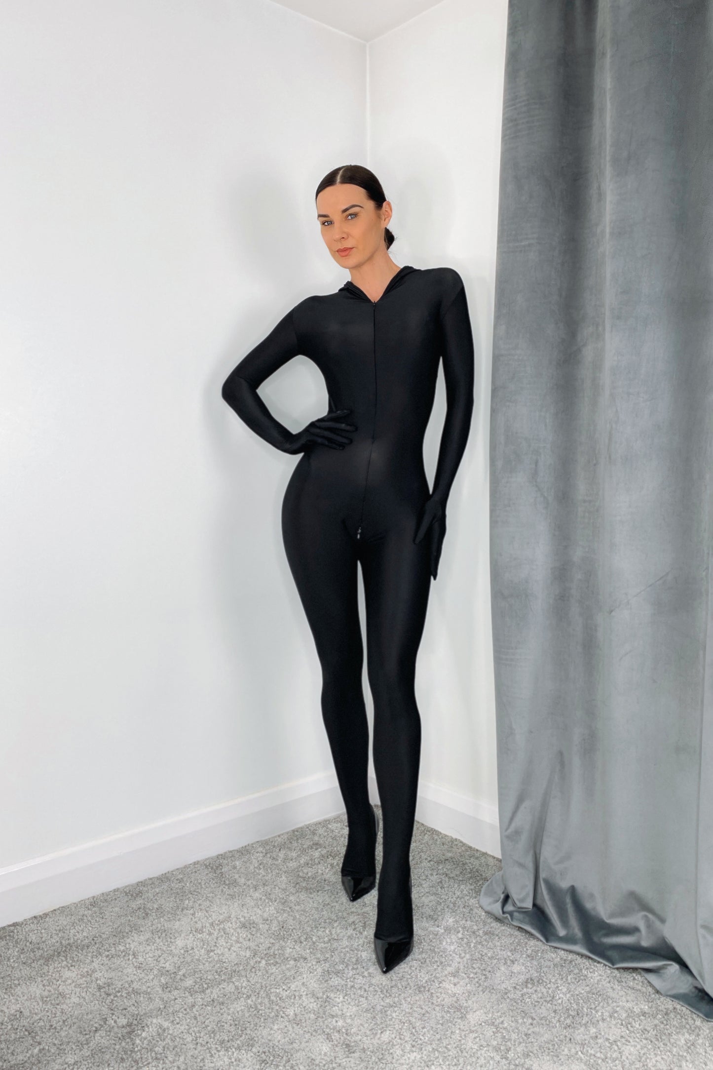 Black spandex bodystocking with gloves, head uncovered