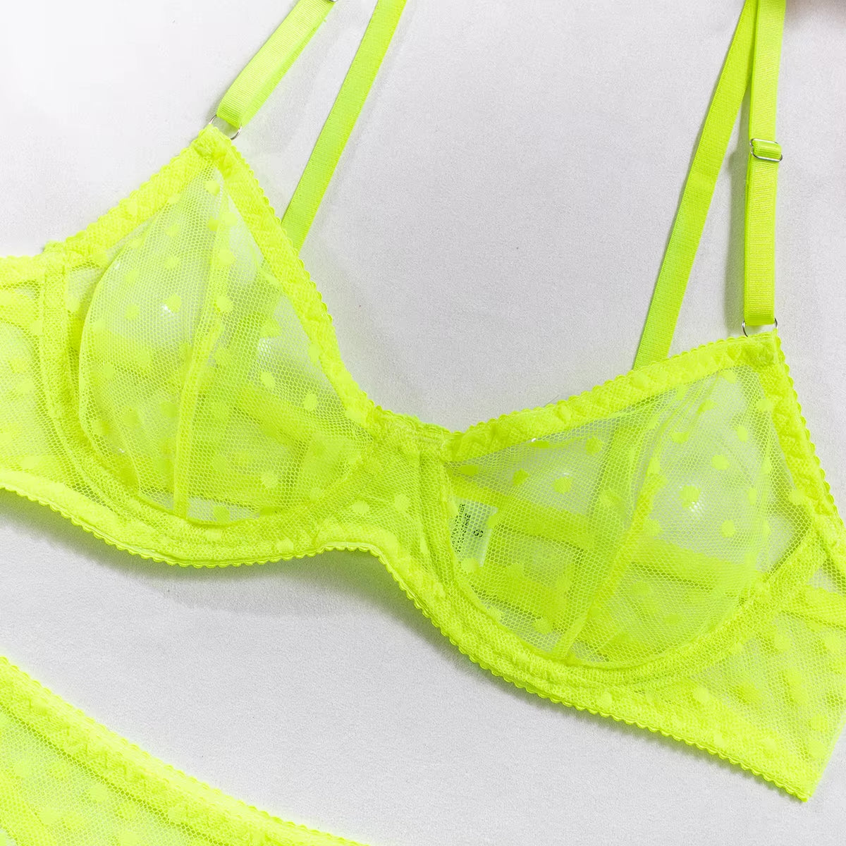 Neon green dot mesh underwired bra with adjustable straps and sheer detailing