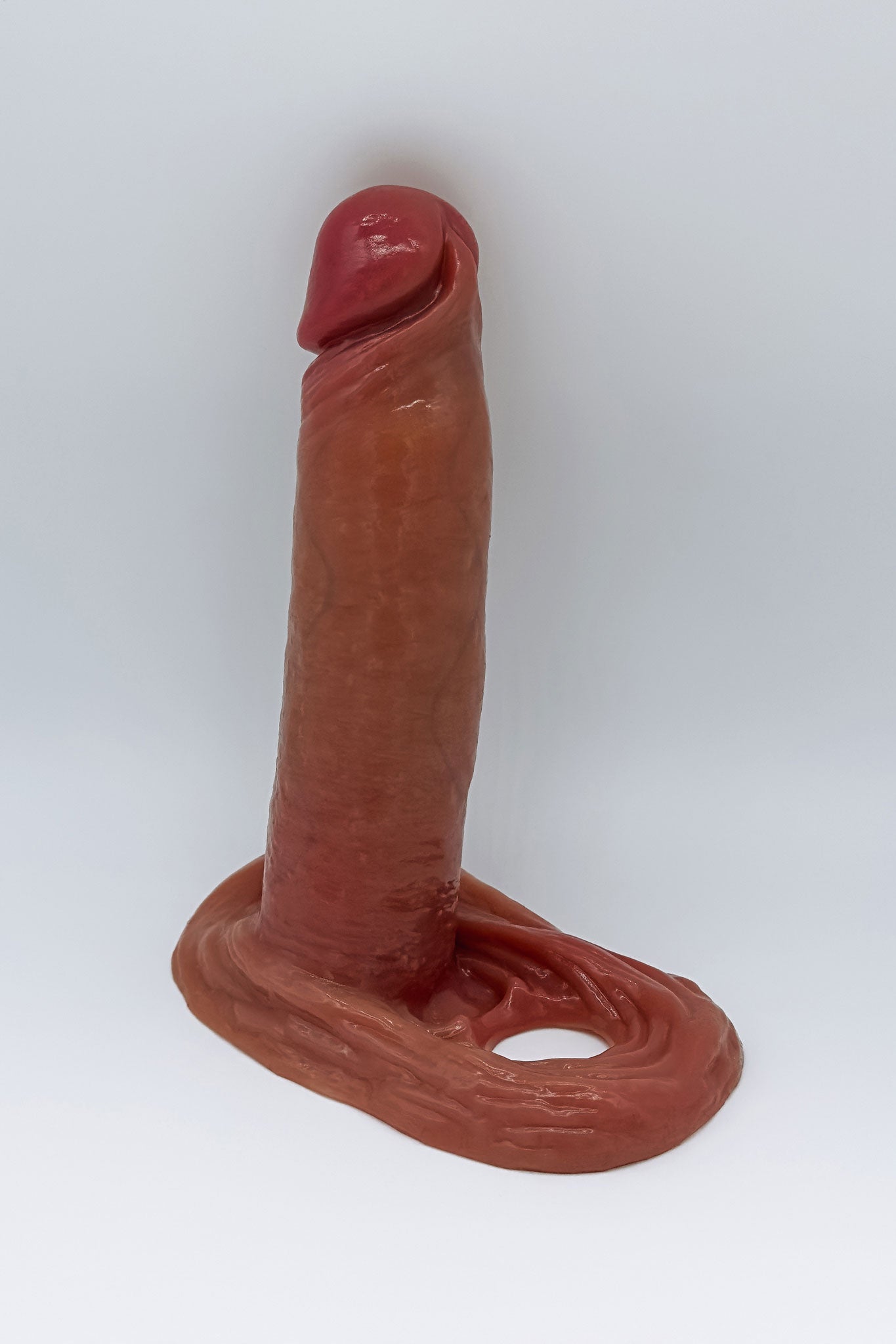 Textured penis extension sleeve featuring testicle ring for secure fit