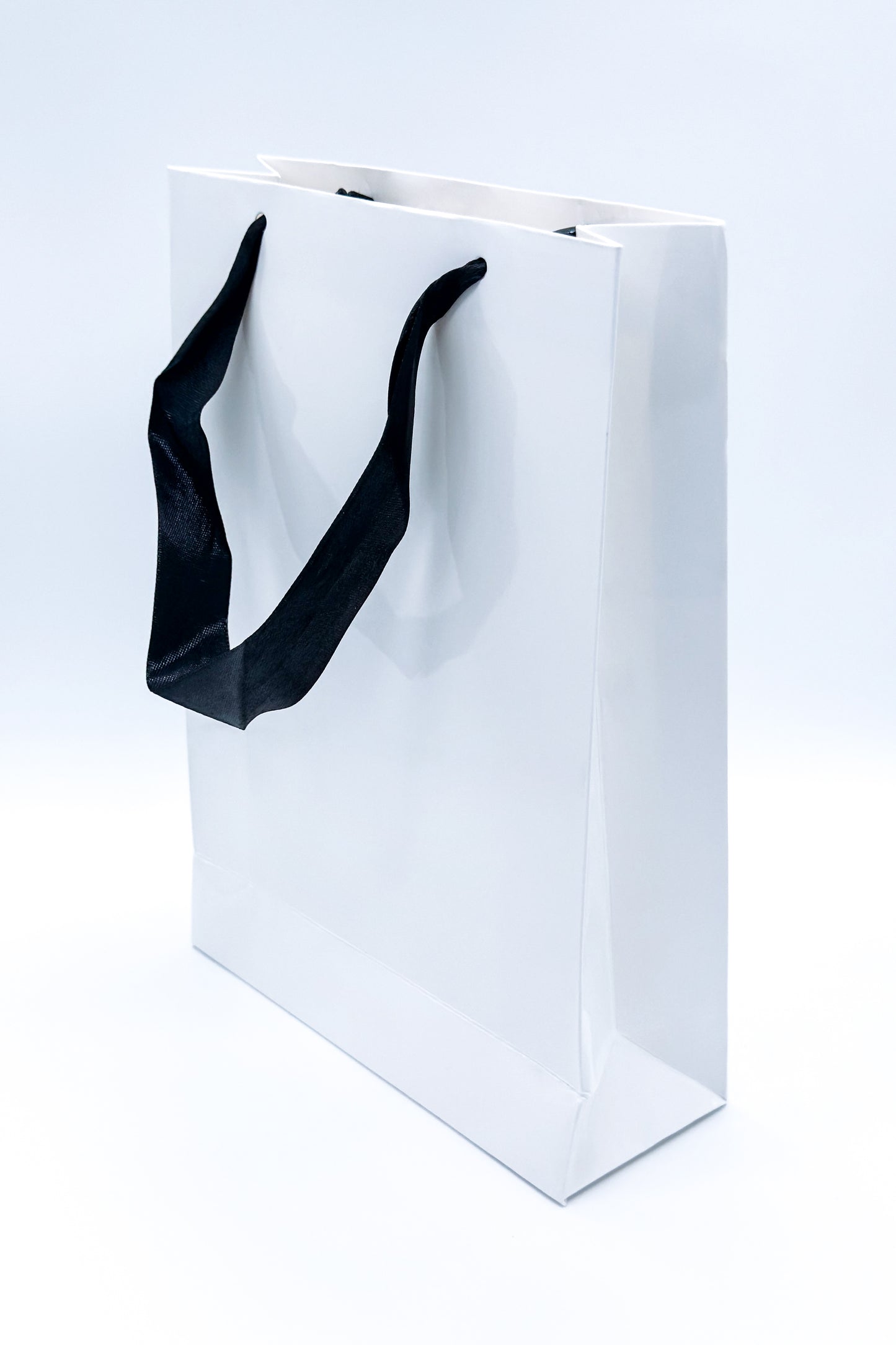 Chic black gift bag with handles – fits bodystockings, tights, or adult gifts