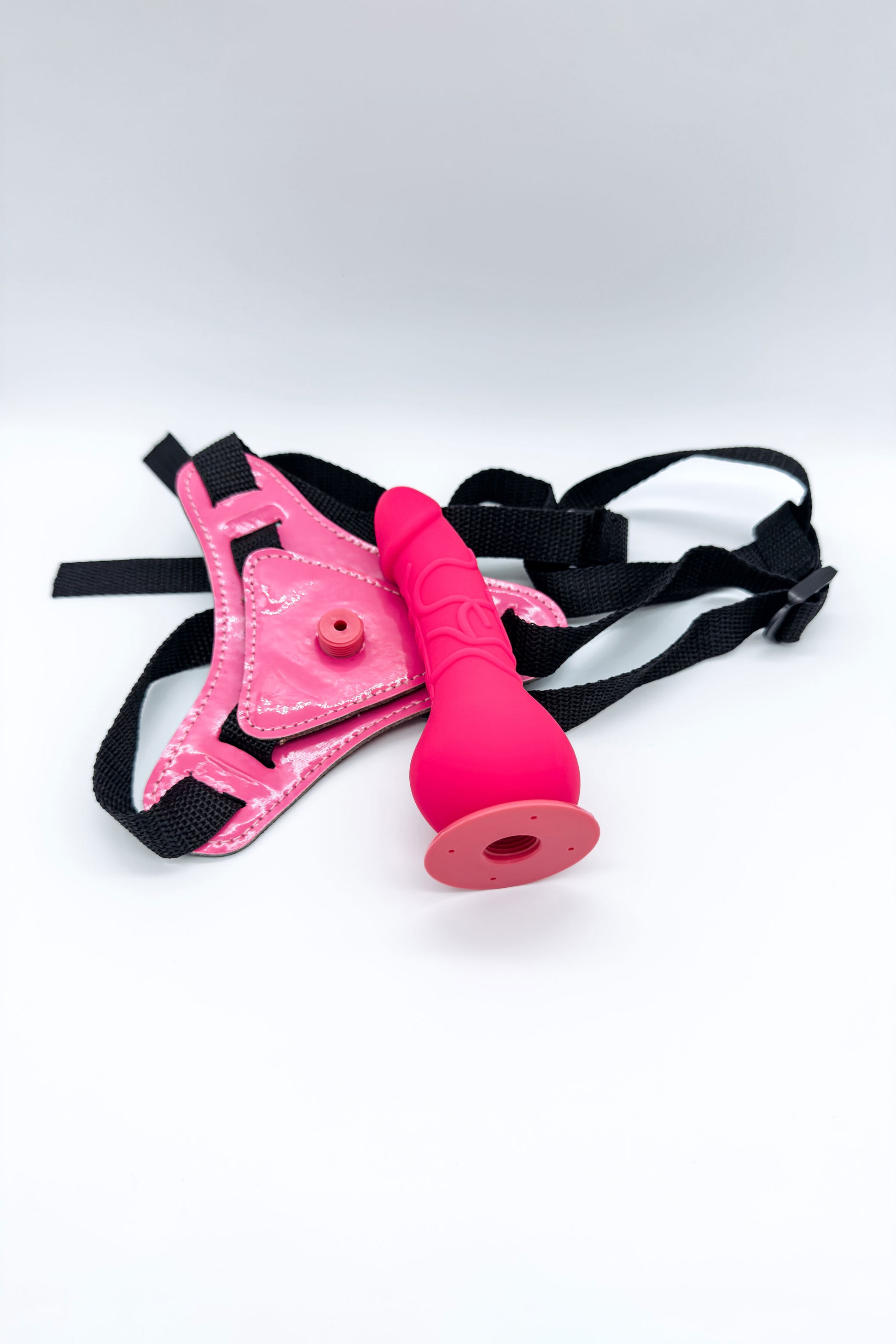 Pink harness and dildo set with secure adjustable fit