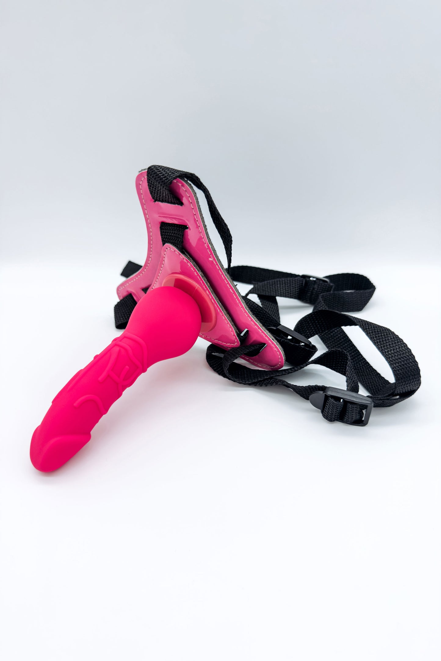 Pink strap on dildo with adjustable harness