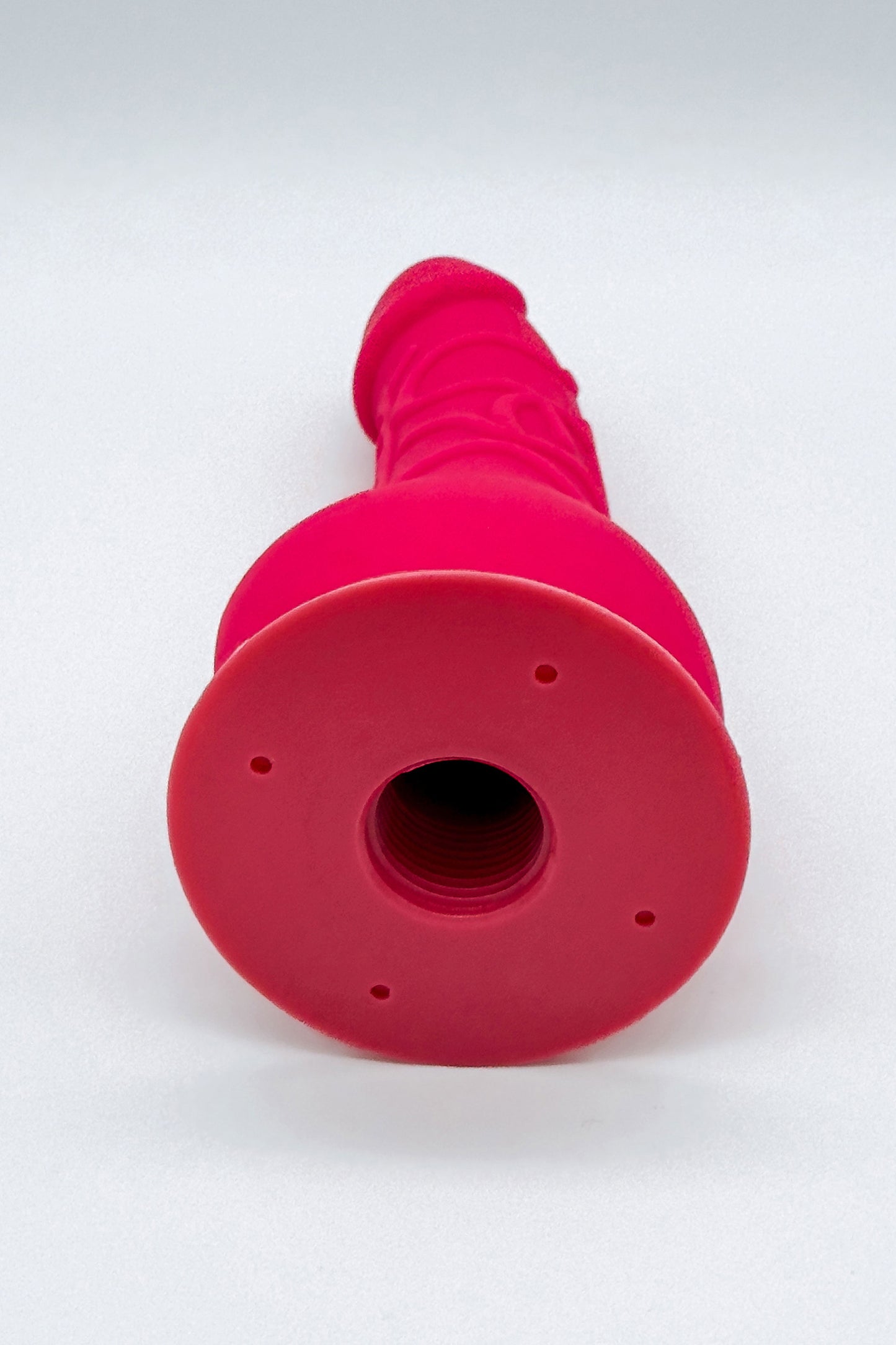 Removable pink dildo attached to adjustable harness