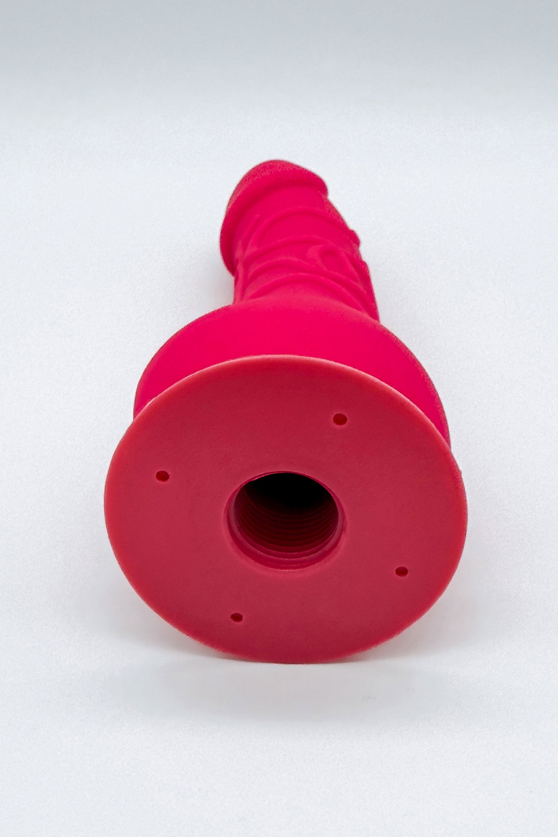 Removable pink dildo attached to adjustable harness