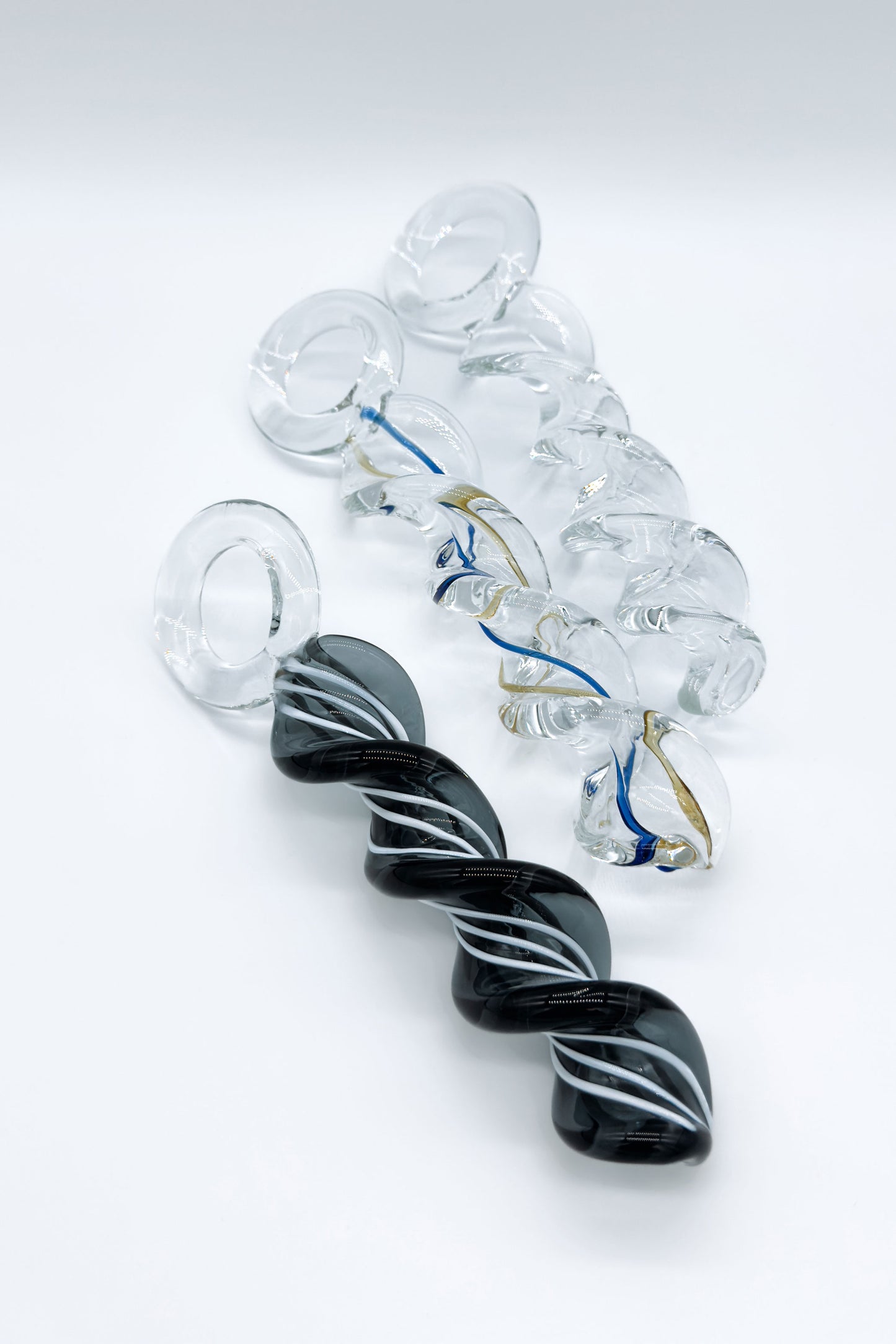 Twisted crystal glass butt plug with spiral design and ring base