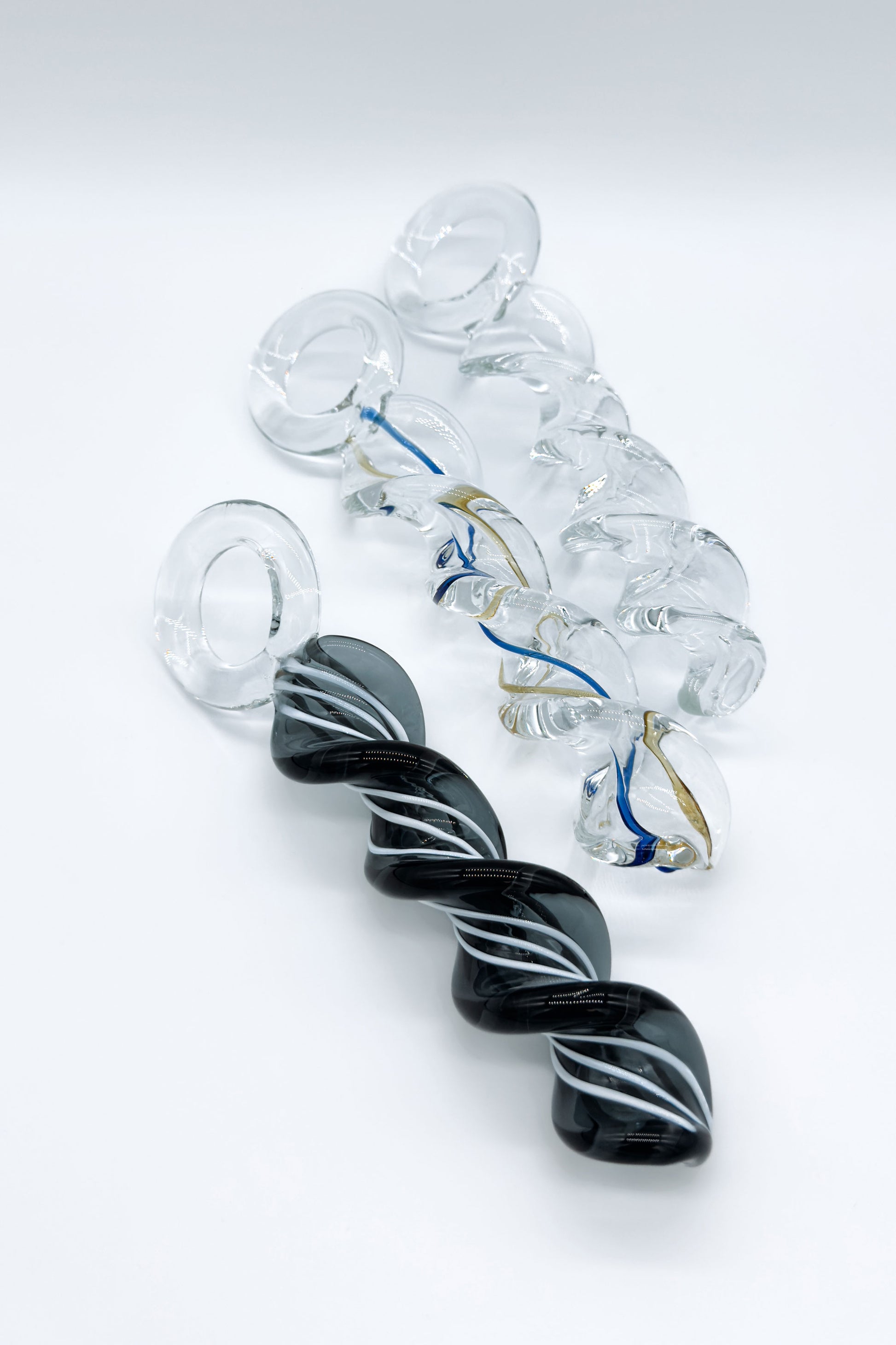 Twisted crystal glass butt plug with spiral design and ring base