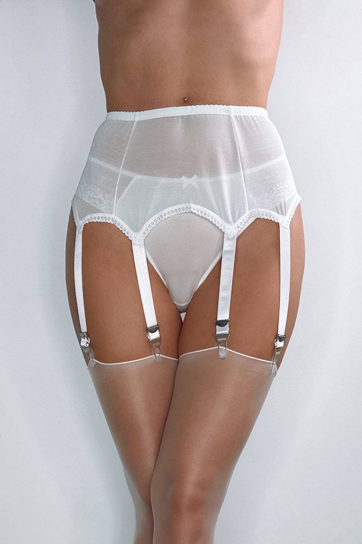 White vintage suspender belt for nylon stockings 
