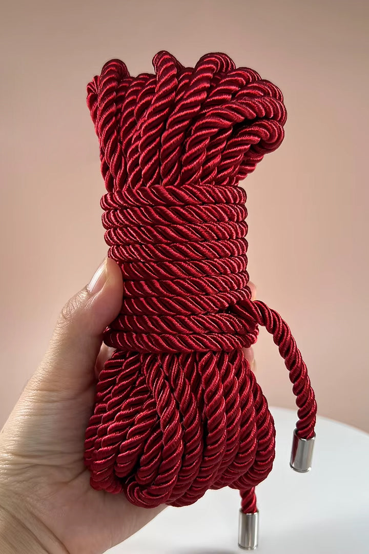 smooth red silky bondage rope
